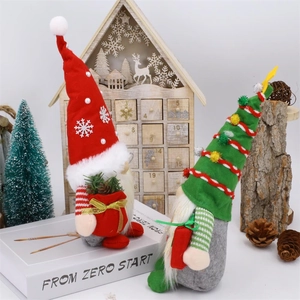 Pair of Christmas faceless gnomes with red and green hats for holiday home decoration