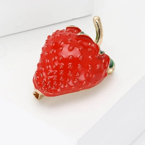 Cute enamel strawberry brooch pin for women made of red alloy with green leaf details