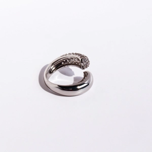 Modern silver open ring with streamlined design and full cubic zirconia inlay stones