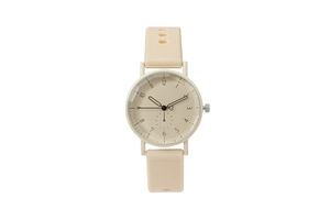 Detail view of beige quartz watch with numeric markers and soft silicone strap