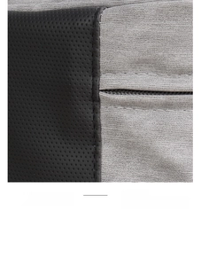 Macro view of black perforated fabric and grey textured material with fine stitching