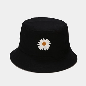 Close-up of high-quality white daisy embroidery on black cotton fisherman hat