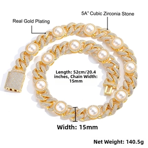 Macro detail of 15mm gold Cuban link chain with 5A+ cubic zirconia and large round pearls