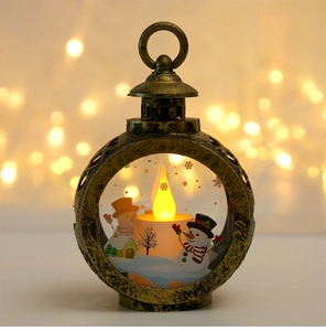 Detail of vintage bronze LED Christmas lantern with snowman pattern and warm glowing candle