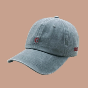 Close-up of vintage washed baseball cap with red letter C embroidery and 199X detail