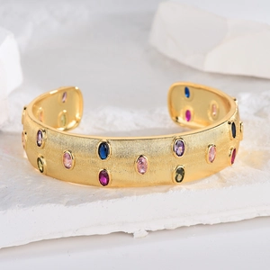 Italian style open bangle with 18k gold brushed finish and colorful oval gemstones