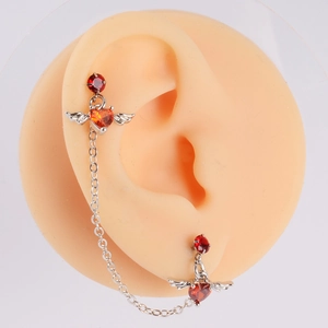 Silver angel wing ear cuff chain with red heart cubic zirconia studs and stars