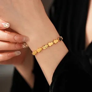 Elegant gold-tone bracelet featuring gourd-shaped links and hollowed-out vintage details