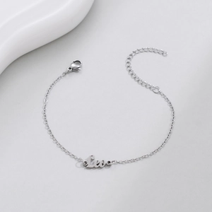 Detail of silver Leo zodiac name bracelet with lobster clasp and extension chain
