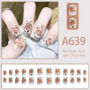 Detail of 24pcs cream press-on nails with cute hand-drawn bear and sun motifs