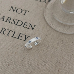 Minimalist S925 sterling silver open ring with blue zircon stones and vertical texture