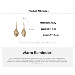 Detailed view of golden twisted teardrop earrings measuring 6.1cm by 1.5cm with S925 silver pins