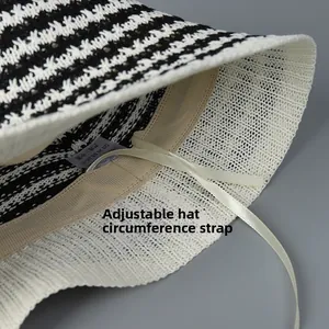 Detail view of the adjustable drawstring inside the striped knit bucket hat for custom fit
