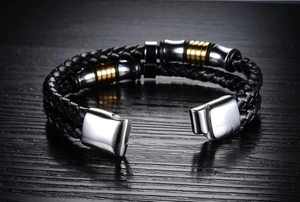 Close-up of men's braided leather bracelet with gold-silver stainless steel magnetic clasp