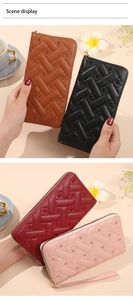 Detailed view of quilted long wallets for women with heart stitching and wristlet strap