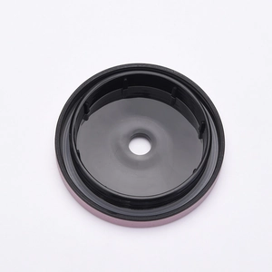 Matte black stainless steel cup lid with central straw hole on a white background
