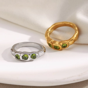Minimalist wavy 18K gold and silver stainless steel rings with three green zircons