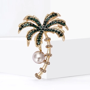 Fashionable gold coconut tree brooch with green crystals and white pearl pendant