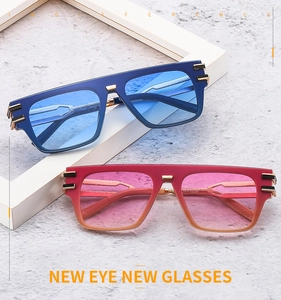 Close-up of stylish gradient lenses with gold-tone metal hinges and frame details