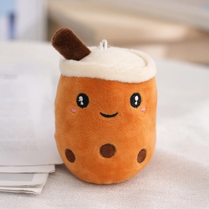 Cute fruit milk tea plush keychain with a soft orange cup and smiling face embroidery