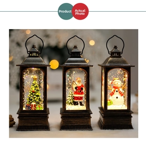 Vintage bronze Christmas lanterns with Santa and Snowman motifs in warm bokeh light