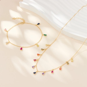 Detailed macro view of S925 sterling silver jewelry set with colorful teardrop zircons