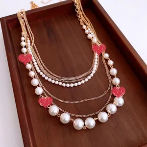 Multi-layer layered faux pearl and gold chain necklace with vintage luxury floral design
