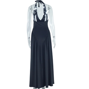 Detail view of the elegant halter backless design on a long black minimalist evening dress