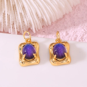 14K gold plated square earring with oval purple tourmaline-like stone on pink background