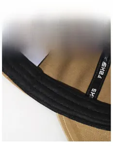 Macro view of wide black sweatband inside washed cotton baseball cap with FBKS text