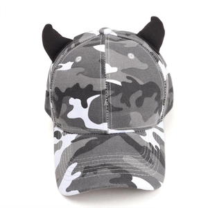 Detail of camouflage baseball cap featuring black 3D devil horns on thick cotton canvas