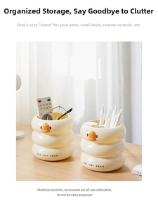 Close-up of duck-shaped multi-functional desk organizer on a wooden tabletop