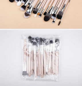 Detail view of 24 professional makeup brushes with synthetic bristles and matte beige handles