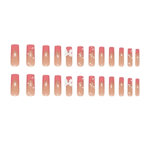 Pink French tip press-on nails with white 3D bows and pearl accents, 24-piece set
