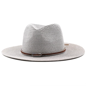 Grey woven straw fedora hat for sun protection with a brown ethnic leather band