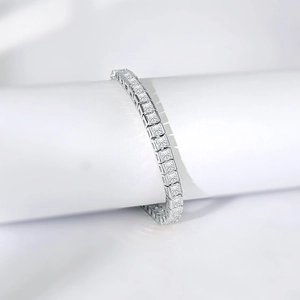 Silver square-cut tennis bracelet with luxury cubic zirconia pave setting on white stand