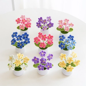 Set of 9 handmade crochet forget-me-not flower pots in mixed vibrant wool colors