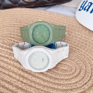 Detail of candy-colored silicone quartz watches with octagonal bezels in green and white
