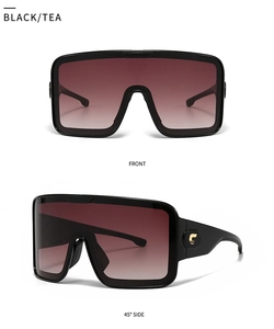 Macro detail of oversized square sunglasses with gold C-hinge and gradient tea lenses