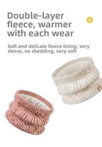 Detail of cable knit neck warmer with thick white fleece lining and leather logo patch