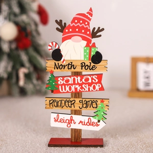 Detail of wooden North Pole Christmas sign featuring a cute gnome and colorful pointers