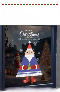 Close-up of static Santa window sticker with Merry Christmas and Happy New Year text