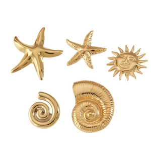 Five-piece set of gold starfish and sea shell brooches with a polished metallic finish