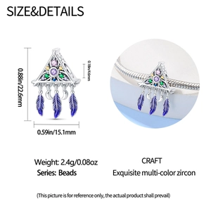 Detail of dreamcatcher moon charm with colorful stones and feathers for bracelet