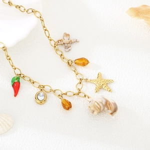 Collier doré avec pendentifs étoile de mer et coquillages et perles pour les vacances
