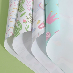 Whimsical wrapping paper set featuring unicorn, cactus, alpaca, and crown patterns