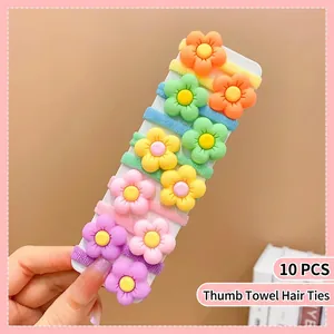 Close-up of 10 colorful elastic nylon flower hair ties for girls on a display card