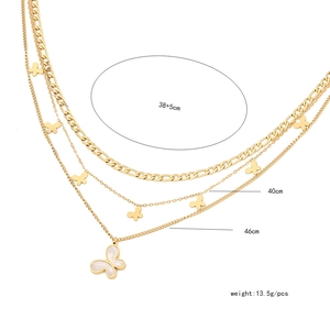 Detail of layered gold shell butterfly necklace with measurements and weight specifications