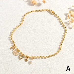 Exotic golden ball chain necklace with crescent moon, evil eye, heart, star and pearl charms