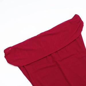 Close-up of wine red sheer mesh fabric with fine knit texture on a sexy off-shoulder dress